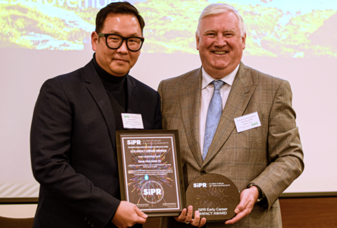 Sean Yu receiving his Impact Award