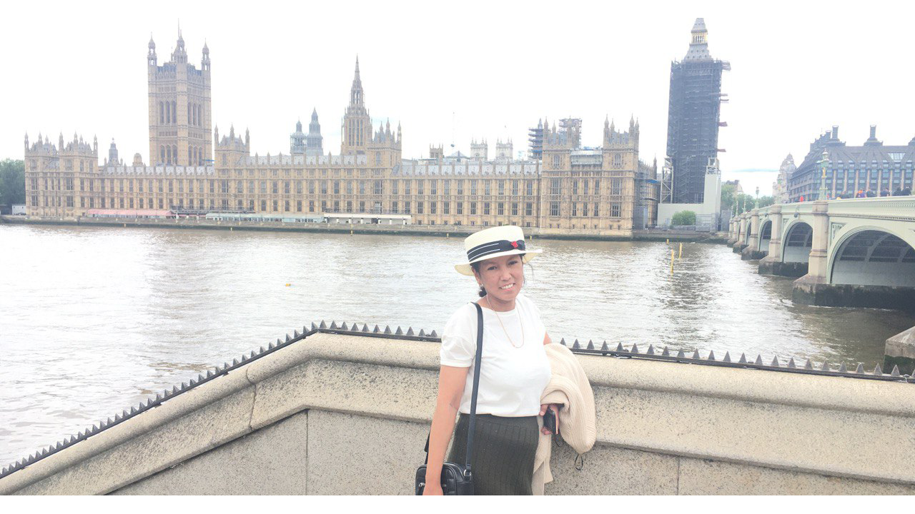 Landscape photo of Gulnaz Tasbolatova taken across the water from the Houses of Parliament