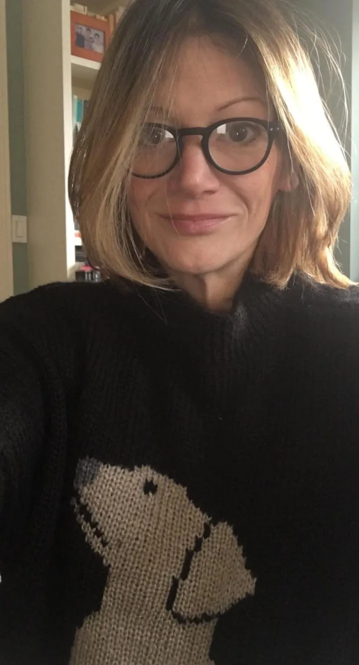 a woman with a black jumper on