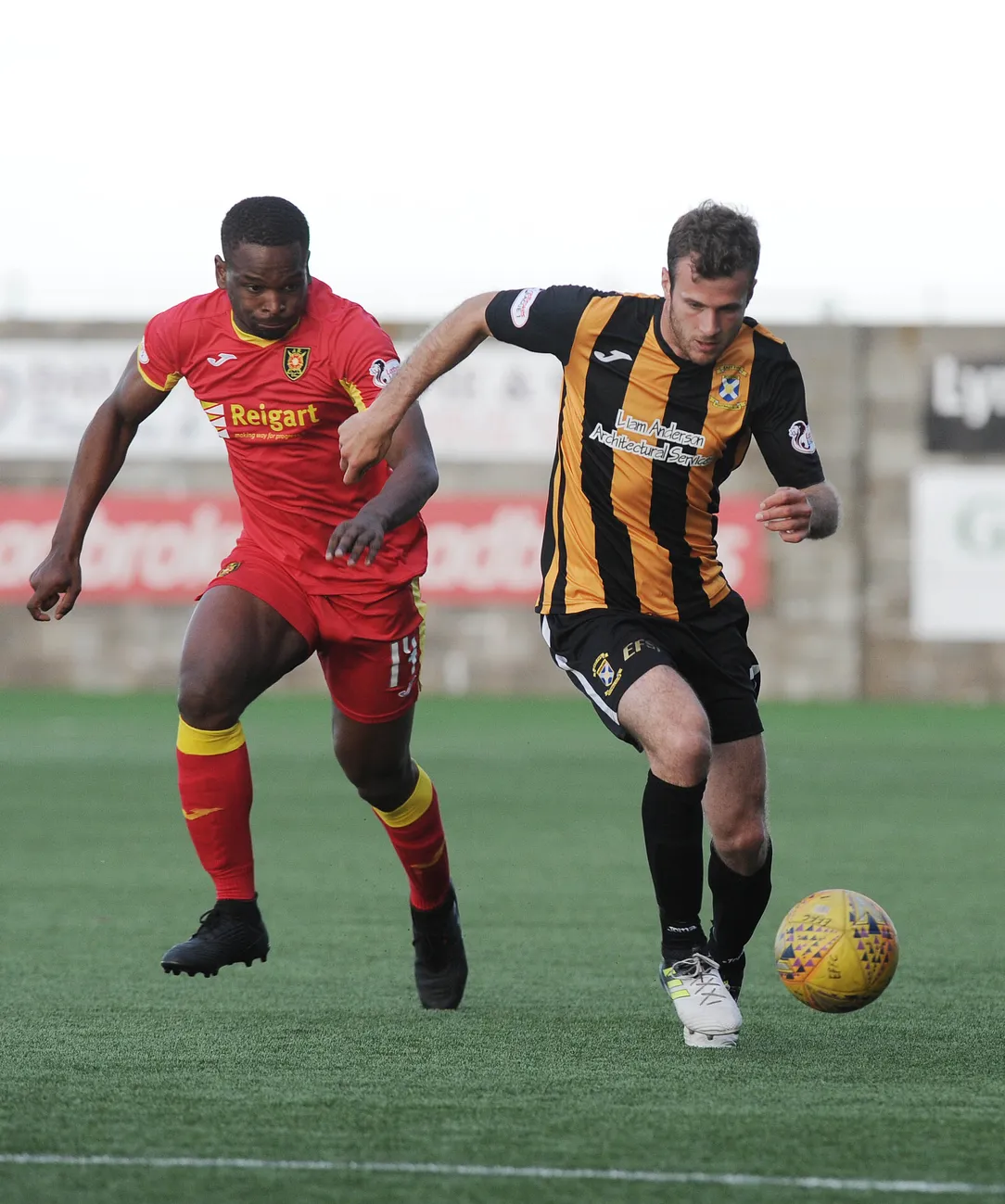 2 men playing football
