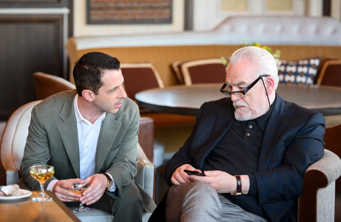 Brian Cox on the set of Succession sitting with his co-star
