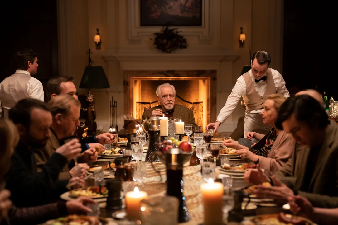 Brian Cox sitting at a dining table for the series Succession