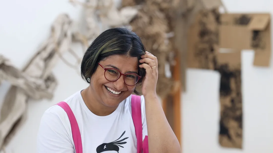 Dhira Chakraborty with her work in the background