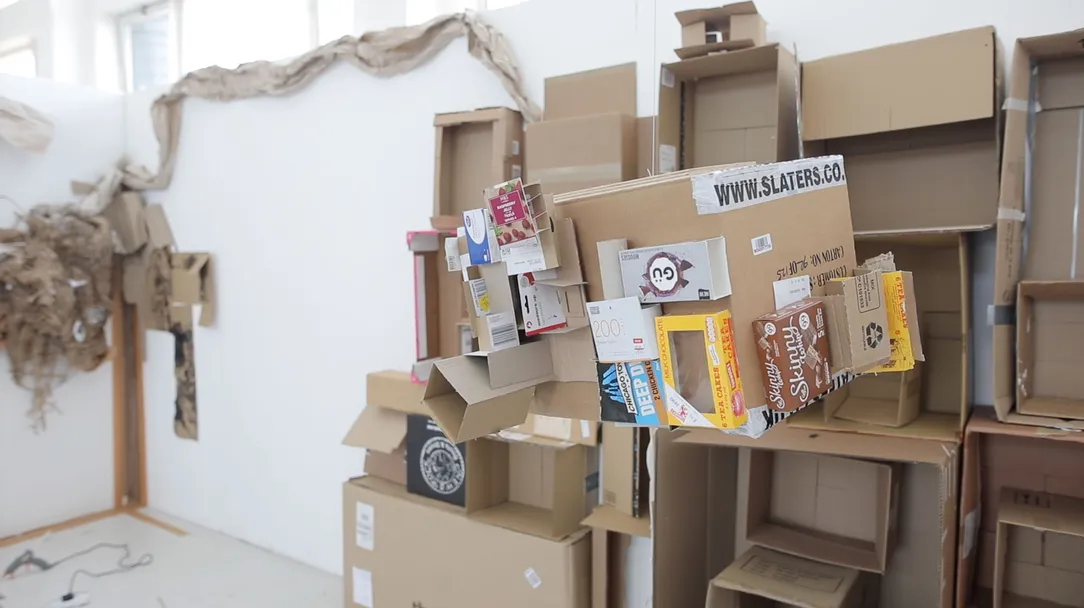 Dhira's work showing cardboard boxes on top of each other