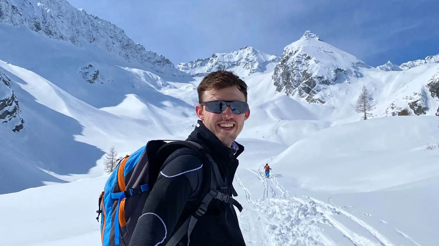 Marco Valzelli surrounded by snow and the alps