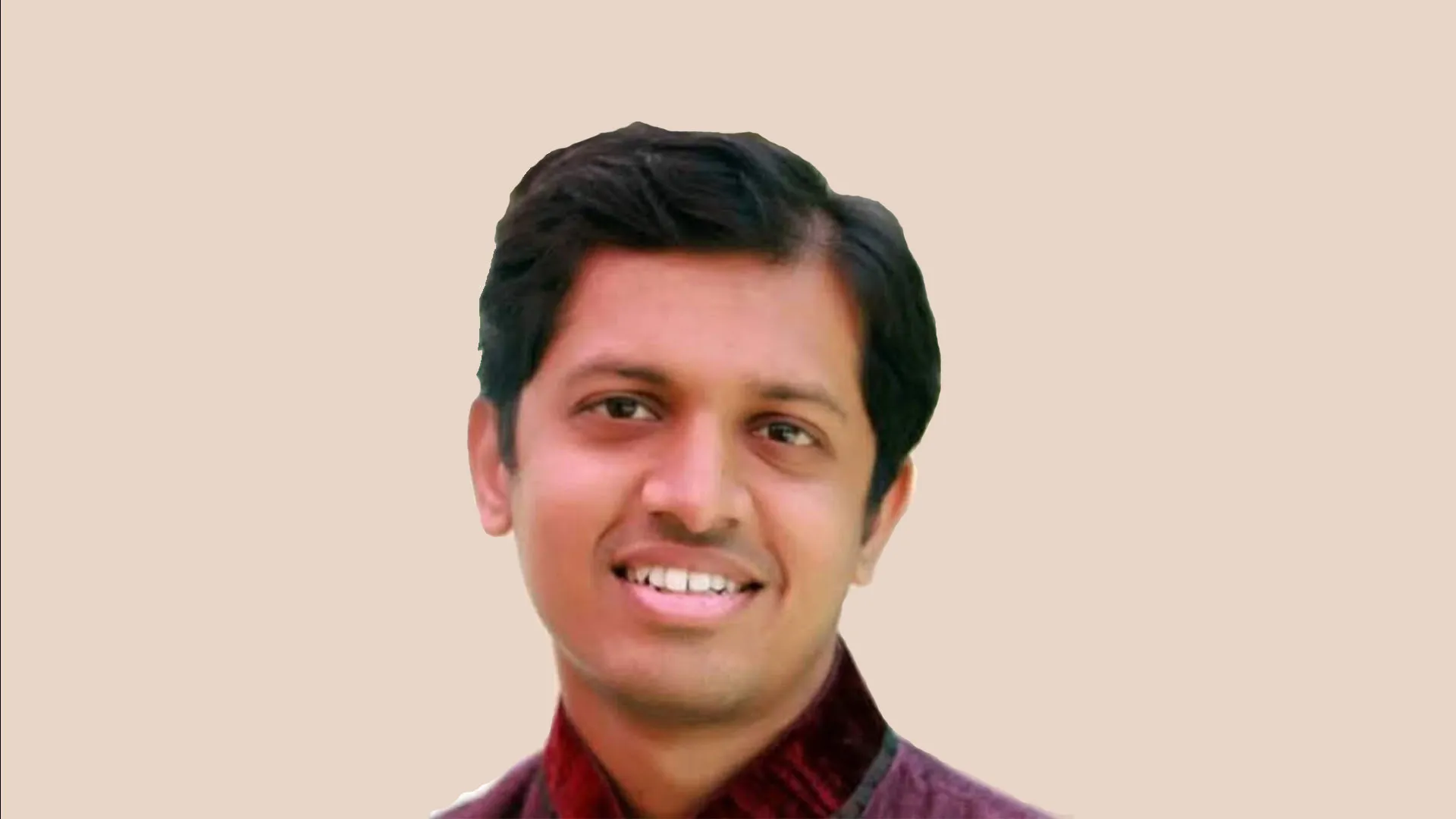 Shreyansh Kayastha with a plain beige background.