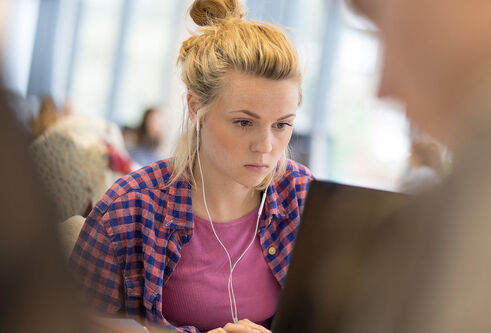 Student sitting at a laptop