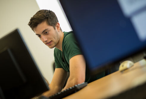 a student working at a computer