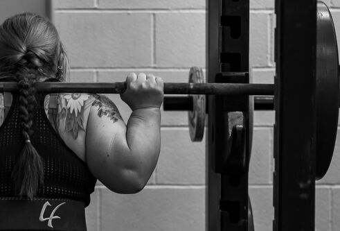 Irene Hallyburton preparing to lift a weight
