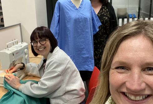 Volunteers in the NHS scrubs hub set up on campus