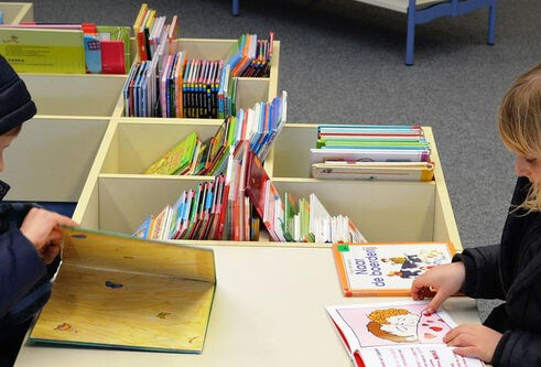 Boy and girl reading books