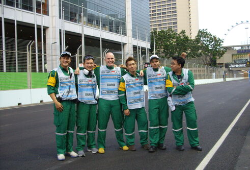 a group of people in green and white clothes