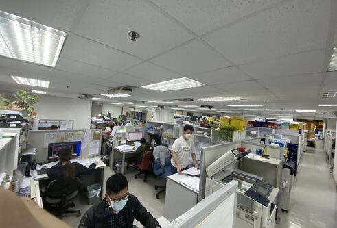an office with desks and chairs