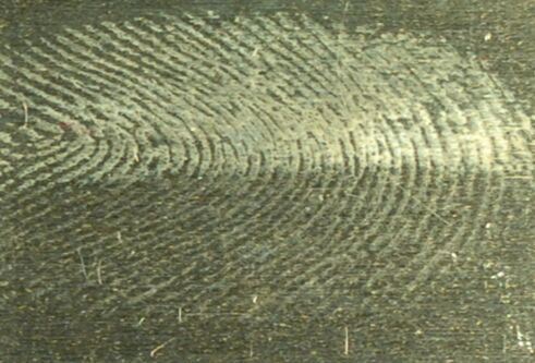 Image of a fingerprint on a metal surface