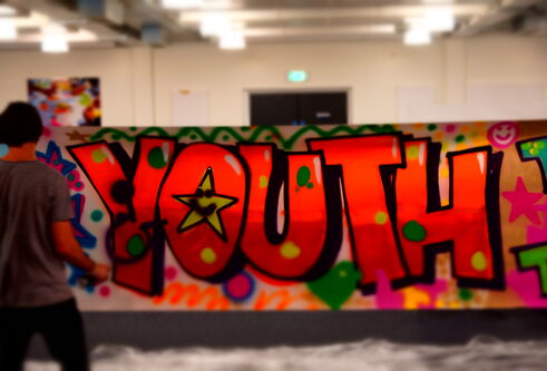 Graffiti on a wall spelling "youth"
