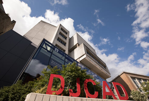 DJCAD building with red letters DJCAD in front of it
