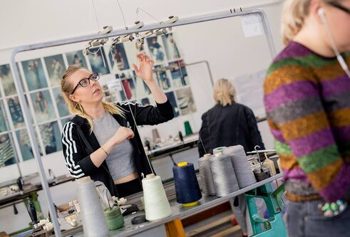 Student using a knitting machine in DJCAD