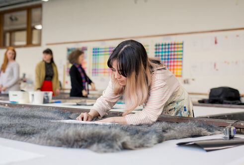 Student working on textiles