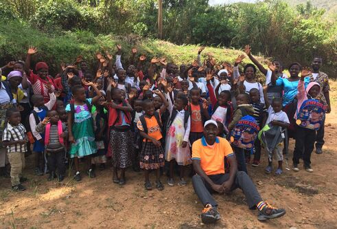 student Jonas Nguh in large group