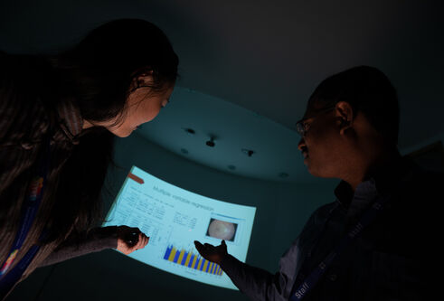 precision medicine experts looking at a screen