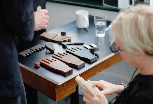 a table with wooden hands on it