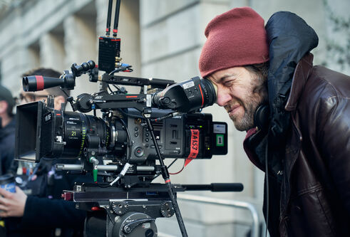 Michael Keillor looking into a TV camera 
