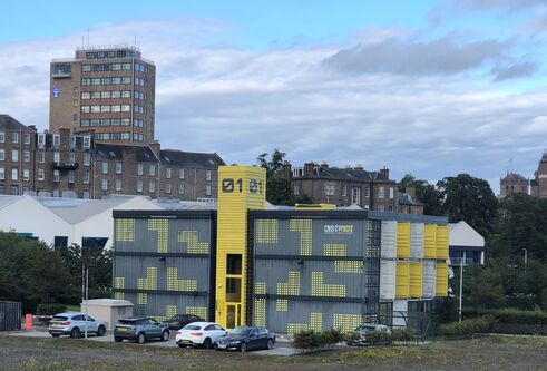 a building made out of shipping containers