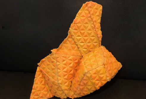 orange origami-like folded sculpture