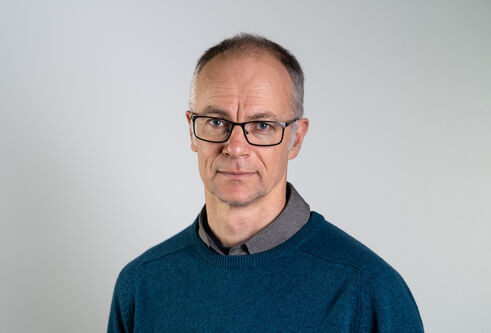 Portrait photo of Tom Owen-Hughes