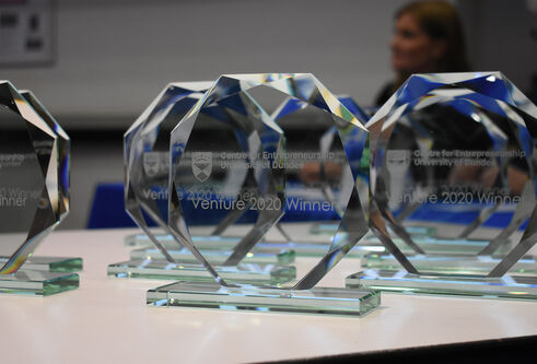 Venture glass trophies with Venture 2020 winners engraved on each one