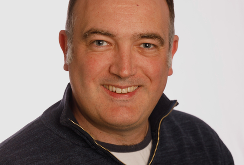 Portrait photo of Nick Brewer