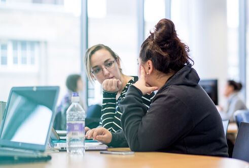 Two students in library