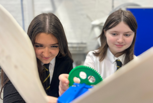 Two secondary school pupils from Arbroath Academy working on an activity at the University of Dundee