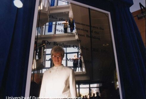Bridget Ogilvie reflected in a plaque dedicated to her.