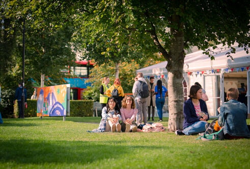 Students sitting on Campus Green