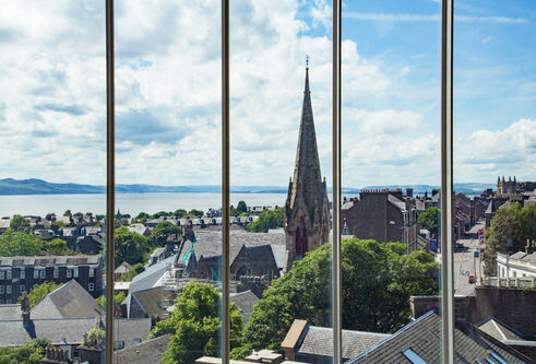 A view of the Dundee skyline out towards the Tay Estuary, as seen through a window at DJCAD