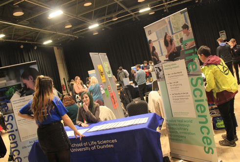 A crowd of people at a Careers fair 