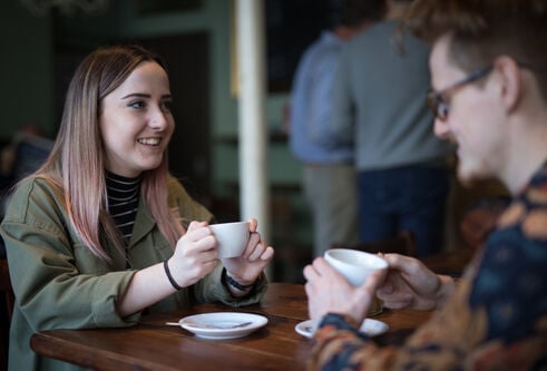 two students sharing coffee