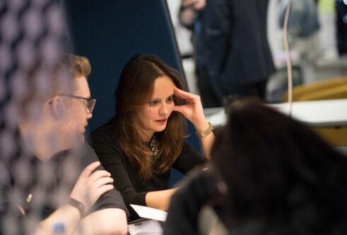man and woman sat at table working