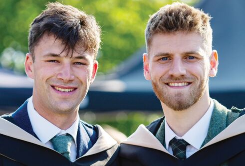 students in graduation robes