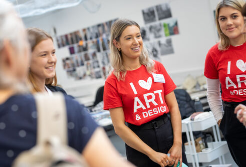 Student Ambassadors with I heart Art & Design t-shirts standing in studio in DJCAD