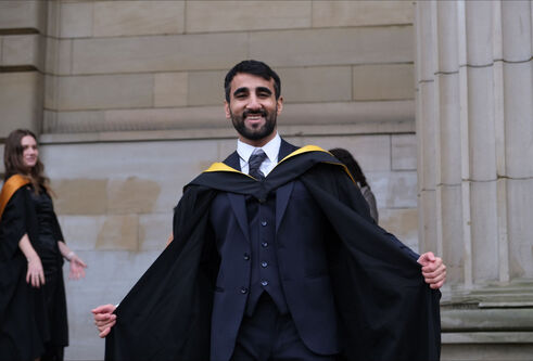 man in graduation robes
