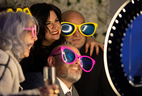 people with fun sunglasses on at party