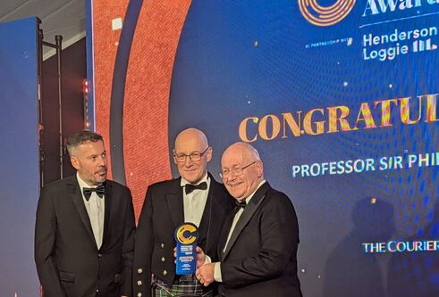 Sir Philip Cohen, with First Minister John Swinney, and The Courier editor David Clegg, all wearing formal wear, at The Courier Business Awards