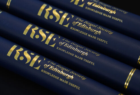 A series of naby blue scrolls with gold RSE branding