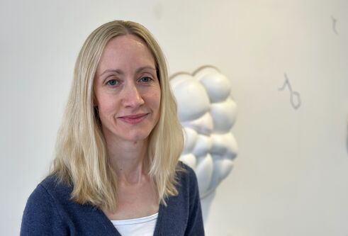 Head and shoulders photo of a woman smiling