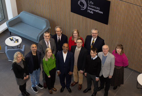 An overview shot of representatives of Chemveda, the University of Dundee, Dundee City Council and Scottish Development International inside the Innovation Hub. 