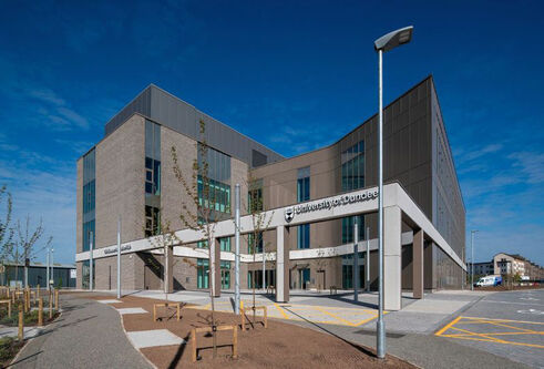 Life Sciences Innovation Hub - a view from the outside of the building looking at the front of the building with steel structure over a paved area