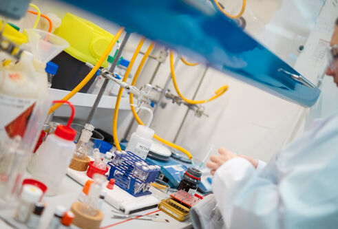 A female scientist in lab coat working in a laboratory