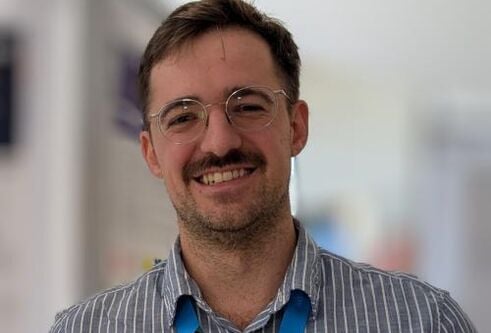 Head and shoulders shot of a man smiling